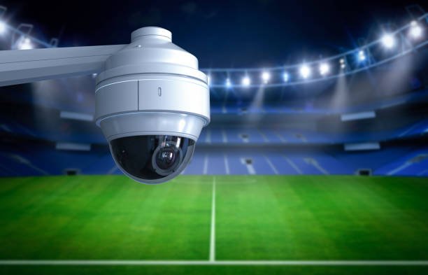 High-definition outdoor bullet security camera mounted on stadium perimeter wall for AI surveillance in the UAE